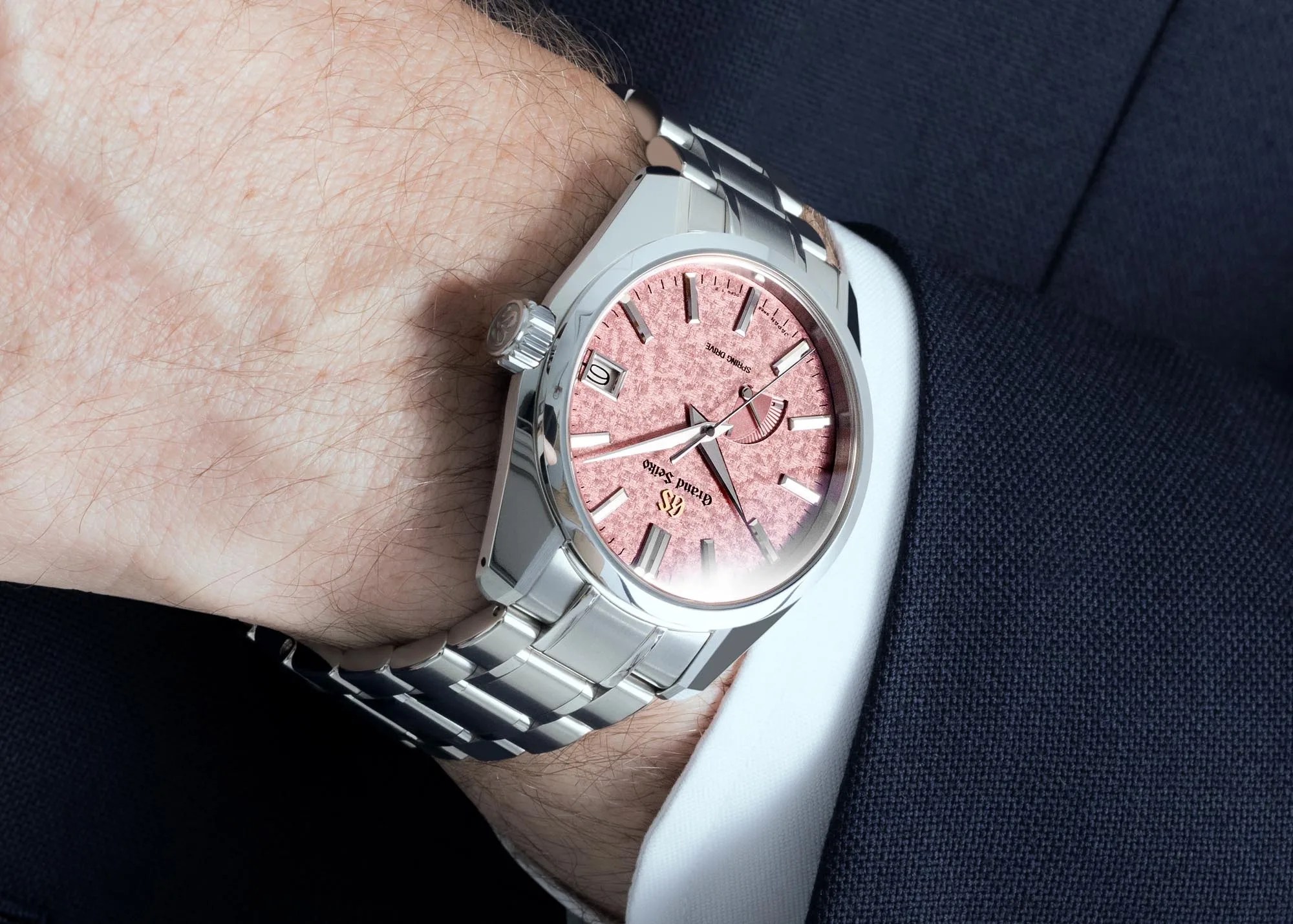 grand seiko watch worn by man in a suit